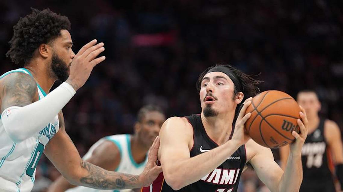  Apr 14, 2026; Charlotte, North Carolina, USA; Miami Heat guard Jaime Jaquez Jr. (11) handles the ball against Charlotte Hornets forward Miles Bridges (0) during the second quarter during the play-in rounds between the Charlotte Hornets and the Miami Heat of the 2026 NBA Playoffs at Spectrum Center. Mandatory Credit: Jim Dedmon-Imagn Images | Jim Dedmon-Imagn Images 