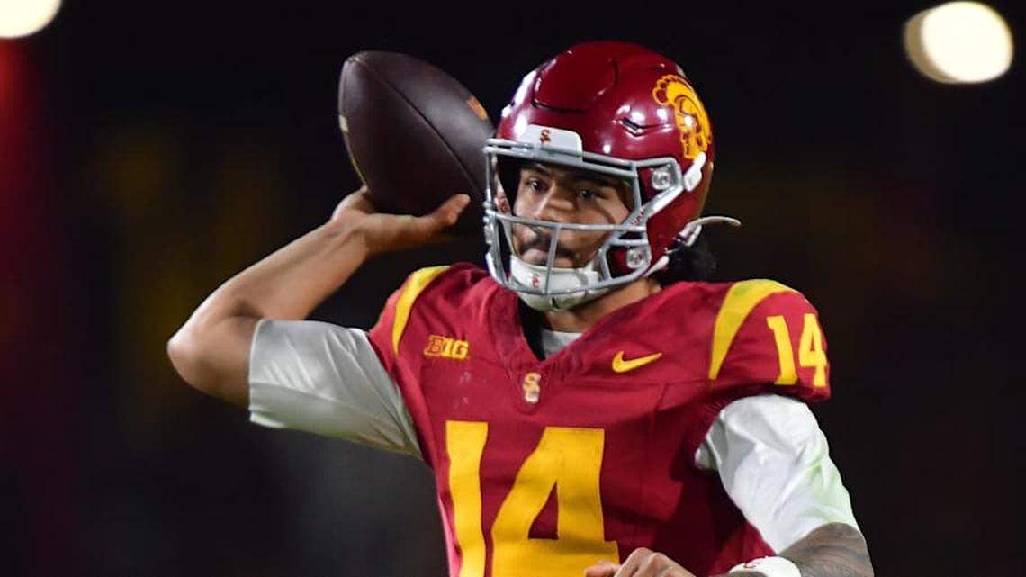  Nov 7, 2025; Los Angeles, California, USA; Southern California Trojans quarterback Jayden Maiava (14) throws against the Northwestern Wildcats during the second half at the Los Angeles Memorial Coliseum. Mandatory Credit: Gary A. Vasquez-Imagn Images | Gary A. Vasquez-Imagn Images 