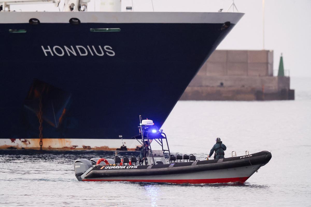 A police boat approaches the cruise ship MV Hondius at the port of Granadilla de Abona after being affected by a hantavirus outbreak, in Tenerife, Spain, May 10, 2026. REUTERS/Hannah McKay