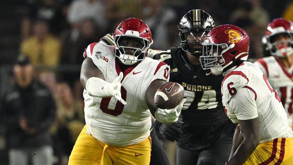  Sep 13, 2025; West Lafayette, Indiana, USA; USC Trojans defensive tackle Jamaal Jarrett (0) makes an interception during the second half against the Purdue Boilermakers at Ross-Ade Stadium. Mandatory Credit: Marc Lebryk-Imagn Images | Marc Lebryk-Imagn Images 