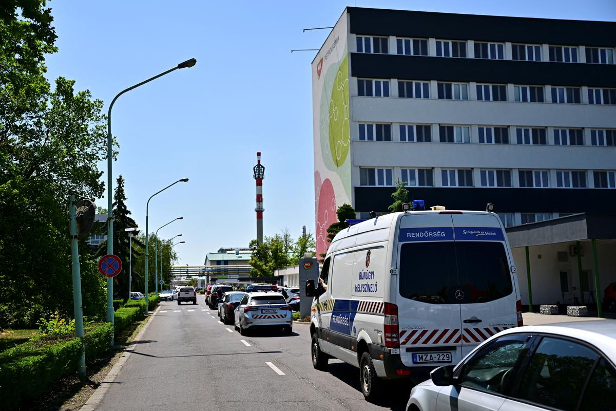 Emergency personnel vehicles outside the gate to the MOL petrochemical plant, where an explosion occurred, in Tiszaujvaros, Hungary, May 22, 2026. REUTERS/Marton Monus