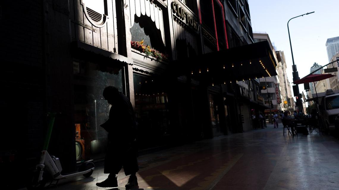 Los Angeles, CA - April 14: A man walks near Clifton's Cafeteria in the downtown historic district on Tuesday, April 14, 2026 in Los Angeles, CA. (Eric Thayer / Los Angeles Times)