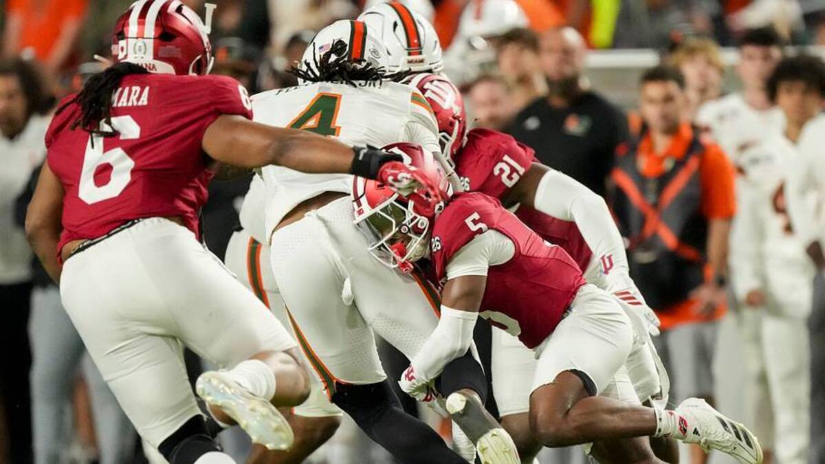  Indiana Hoosiers defensive back D'Angelo Ponds (5) tackles Miami (FL) Hurricanes running back Mark Fletcher Jr. (4) on Monday, Jan. 19, 2026, during the College Football Playoff National Championship college football game at Hard Rock Stadium in Miami Gardens. | USA TODAY Network via Reuters Connect 