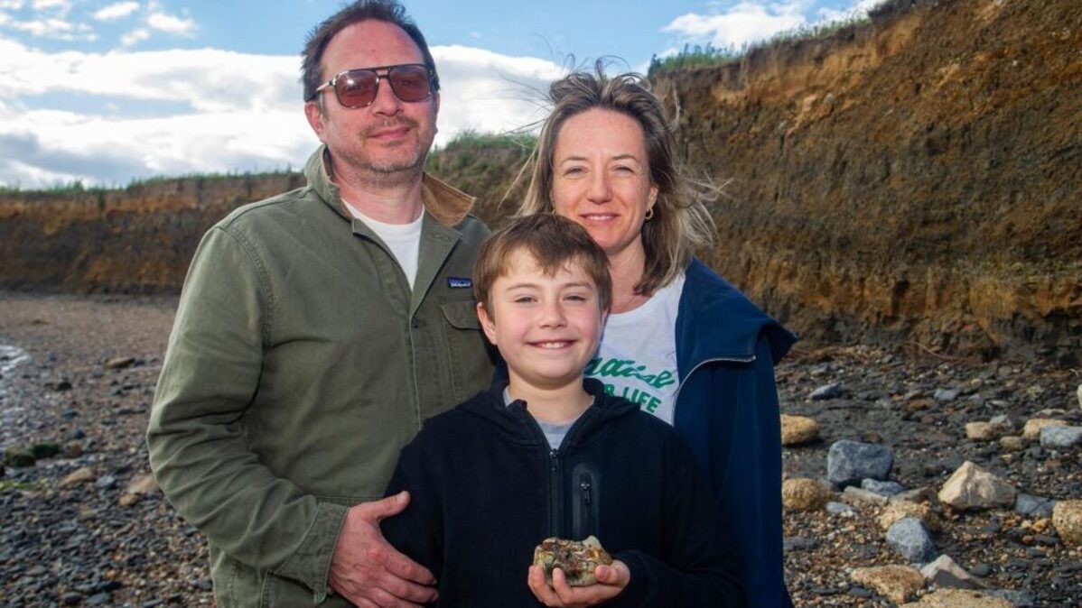 Charlie, 11, with parents Eleanor and Jamie. (Eastern Daily Press / Newsquest via SWNS). 