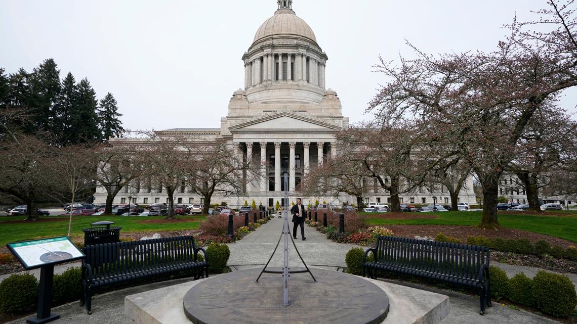 The sun dial near Washington’s Legislative Building in Olympia is shown under cloudy skies March 10. Nearly two dozen lawmakers will not be seeking re-election to their seats.