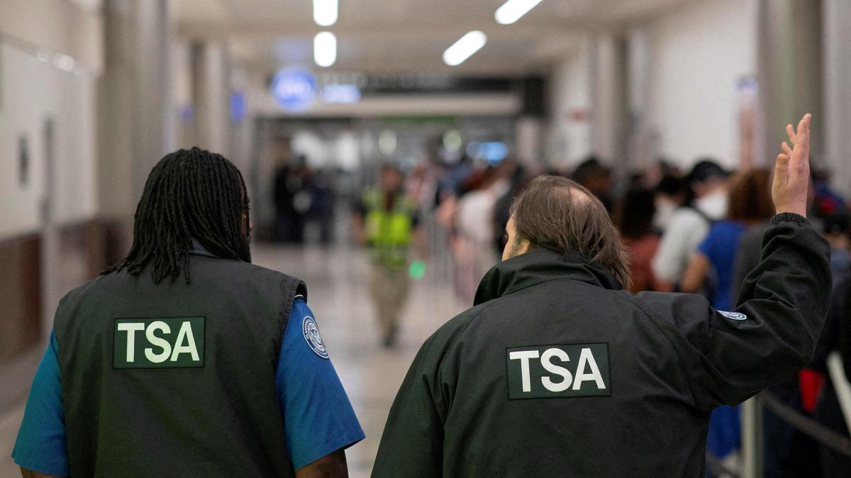 Transportation Security Administration (TSA) officers walk through the domestic terminal at Hartsfield-Jackson Atlanta International Airport in Atlanta, Georgia, March 27, 2026. REUTERS/Alyssa Pointer