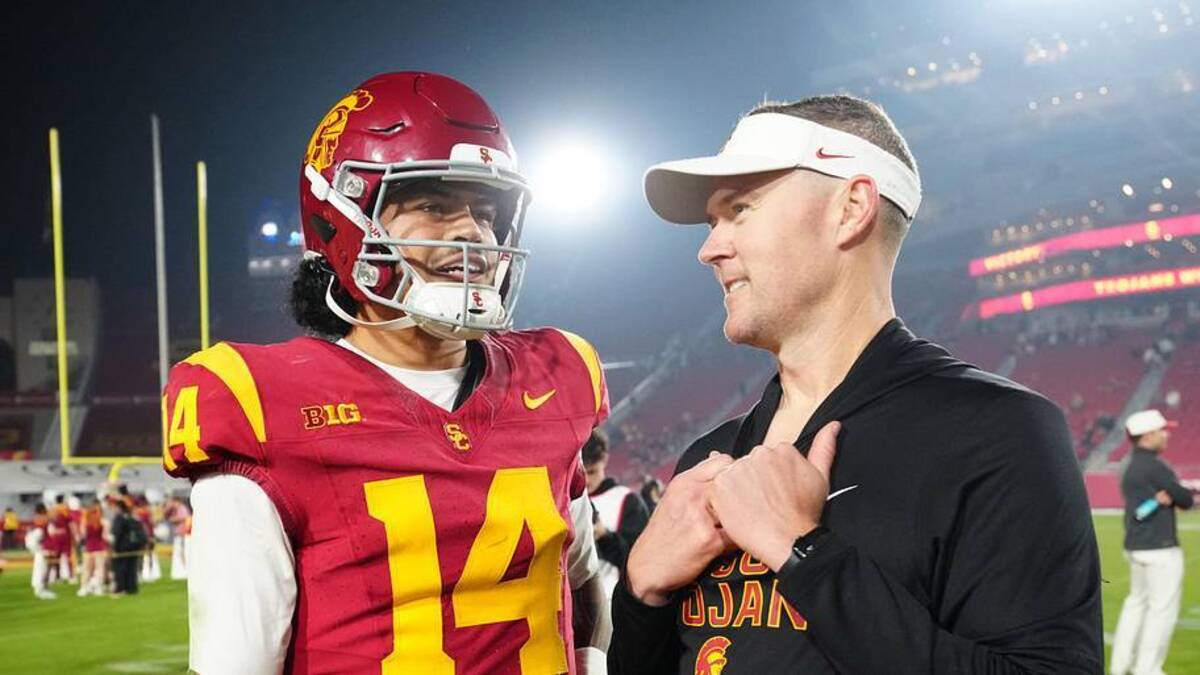  Nov 29, 2025; Los Angeles, California, USA; Southern California Trojans quarterback Jayden Maiava (14) and head coach Lincoln Riley react after the game against the UCLA Bruins at United Airlines Field at Los Angeles Memorial Coliseum. Mandatory Credit: Kirby Lee-Imagn Images | Kirby Lee-Imagn Images 