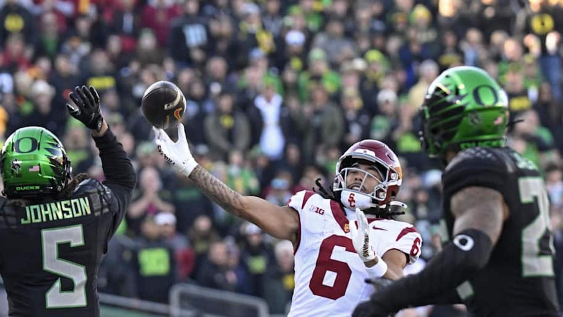  Nov 22, 2025; Eugene, Oregon, USA; Southern California Trojans wide receiver Makai Lemon (6) throws a touch down pass against the Oregon Ducks during the first half at Autzen Stadium. Mandatory Credit: Troy Wayrynen-Imagn Images | Troy Wayrynen-Imagn Images 