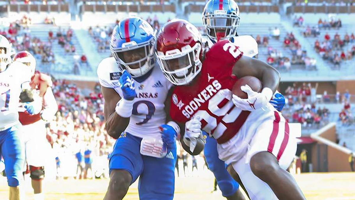  Nov 7, 2020; Norman, Oklahoma, USA; Oklahoma Sooners running back Rhamondre Stevenson (29) scores a touchdown as Kansas Jayhawks cornerback Karon Prunty (9) defends during the first half at Gaylord Family-Oklahoma Memorial Stadium. Mandatory Credit: Kevin Jairaj-Imagn Images | Kevin Jairaj-Imagn Images 