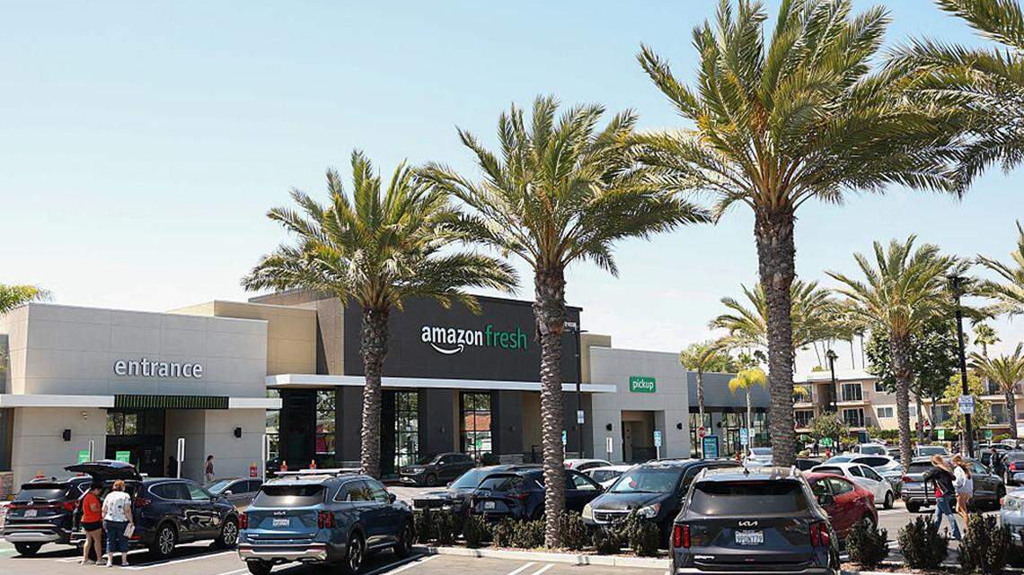 Shopper outside of an Amazon Fresh grocery store in Torrance, California, on July 29, 2025. The online retail giant is moving ahead with another major round of layoffs that will impact workers in four states, spanning corporate offices and physical retail locations, such as its grocery stores.
