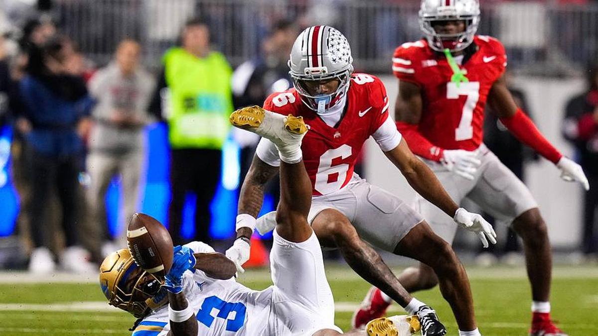  UCLA Bruins wide receiver Kwazi Gilmer (3) attempts to catch a pass against Ohio State Buckeyes cornerback Devin Sanchez (6) in the first half of the NCAA college football game at Ohio Stadium on Saturday, Nov. 15, 2025 in Columbus, Ohio. | Samantha Madar/Columbus Dispatch / USA TODAY NETWORK via Imagn Images 