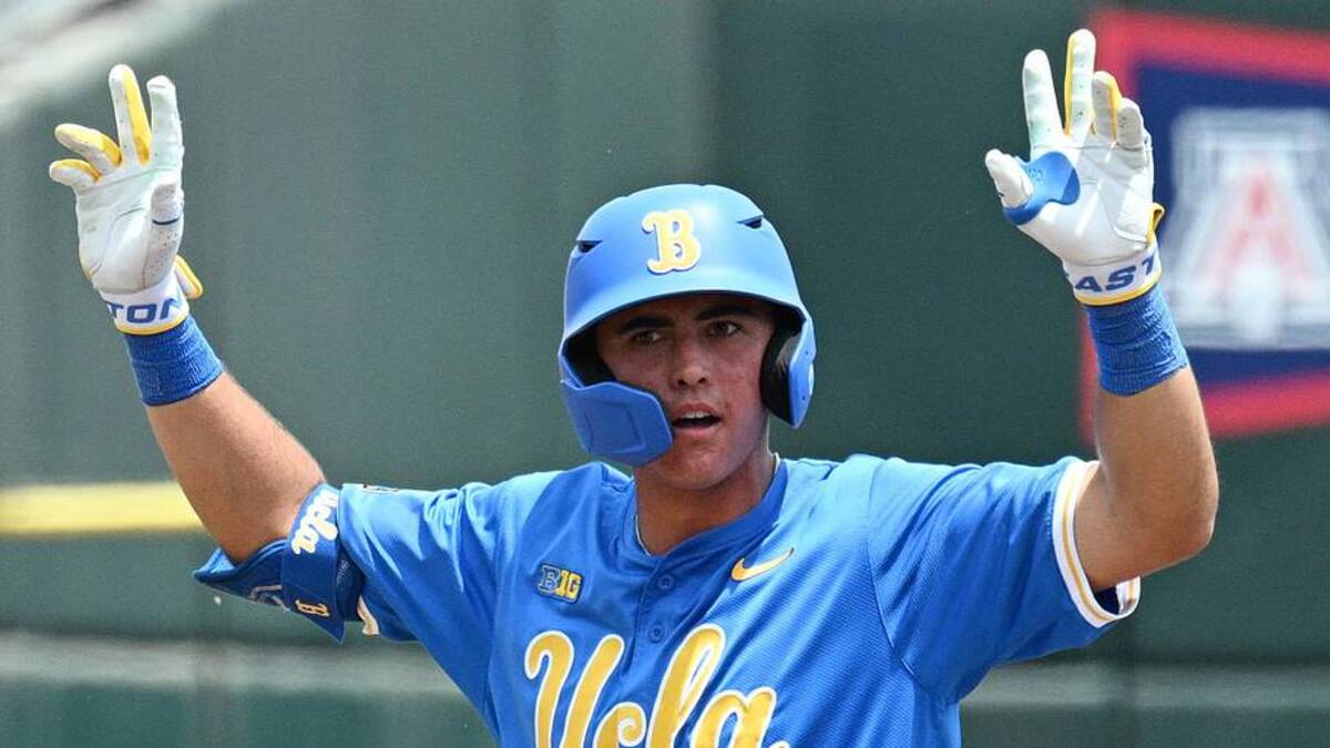  Jun 14, 2025; Omaha, Neb, USA; UCLA Bruins catcher Cashel Dugger (40) signals after hitting a double against the Murray State Racers during the second inning at Charles Schwab Field. Mandatory Credit: Steven Branscombe-Imagn Images | Steven Branscombe-Imagn Images 