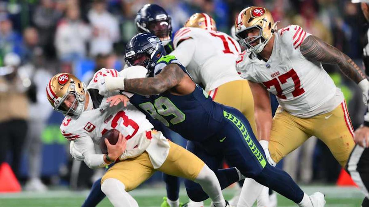 Jan 17, 2026; Seattle, WA, USA; San Francisco 49ers quarterback Brock Purdy (13) is sacked by Seattle Seahawks defensive end Leonard Williams (99) during the second half in an NFC Divisional Round game at Lumen Field. Mandatory Credit: Steven Bisig-Imagn Images | Steven Bisig-Imagn Images 