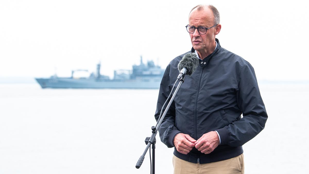 German Chancellor Friedrich Merz speaks on the submarine hunting frigate "Bayern" while visiting the Germany Navy on Aug. 28, 2025, near Rostock, Germany. (Daniel Bockwoldt/Getty Images/TNS)
