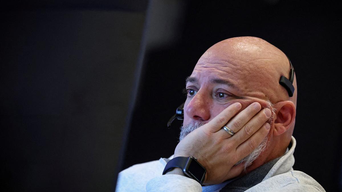 FILE PHOTO: A trader works on the floor at the New York Stock Exchange (NYSE) in New York City, U.S., May 26, 2026. REUTERS/Brendan McDermid/File Photo