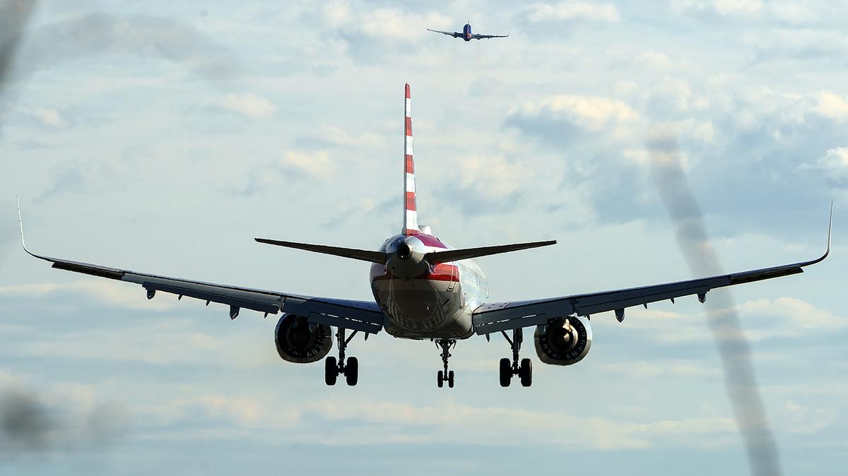 An American Airlines plane lands at Reagan National Airport in Arlington, Va., on Thursday, February 23, 2023.