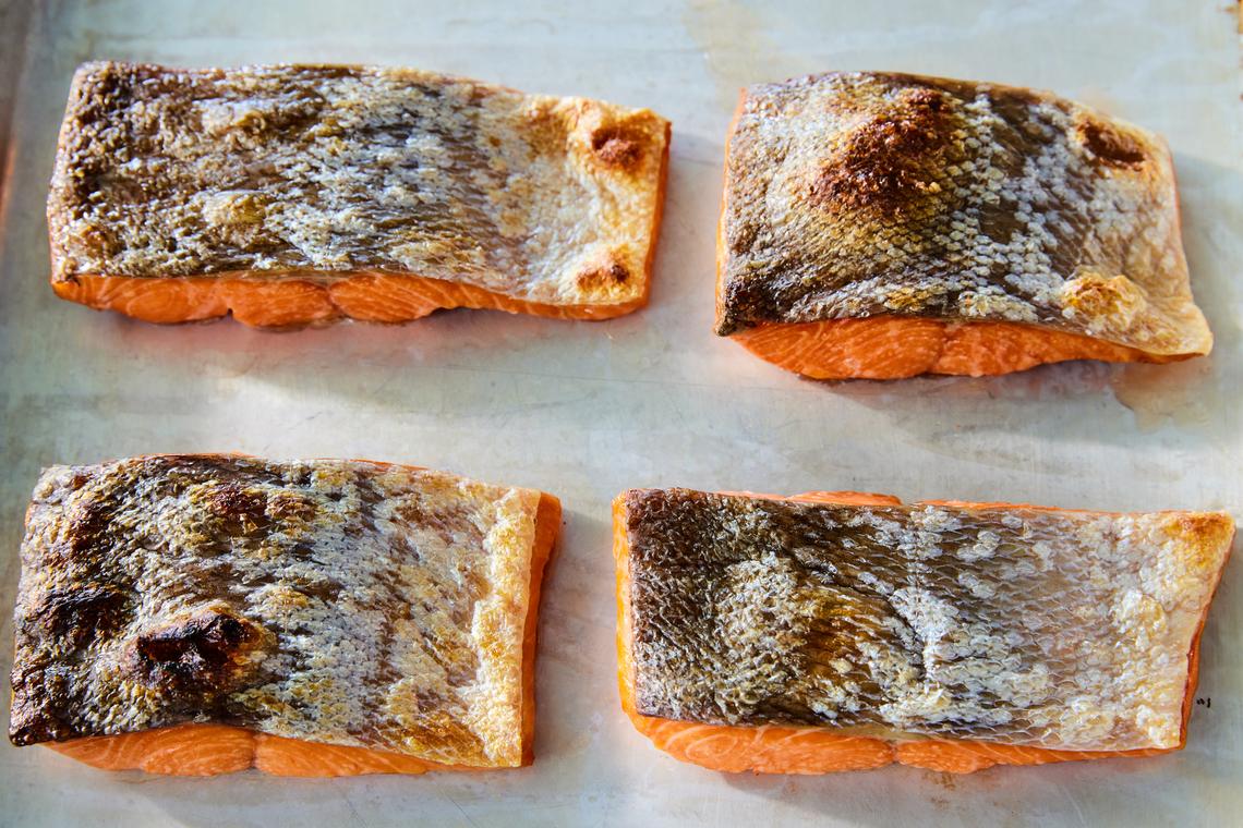 Dry-brined salmon. For juicier fish and crispier skin, salt the fish for at least 15 minutes or up to two hours. Food styled by Maggie Ruggiero. (Ryan Liebe/The New York Times)