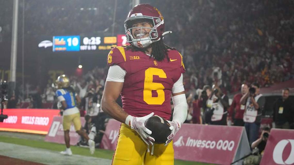  Nov 29, 2025; Los Angeles, California, USA; Southern California Trojans wide receiver Makai Lemon (6) celebrates after catching a 32-yard touchdown pass against the UCLA Bruins in the second half at United Airlines Field at Los Angeles Memorial Coliseum. Mandatory Credit: Kirby Lee-Imagn Images | Kirby Lee-Imagn Images 