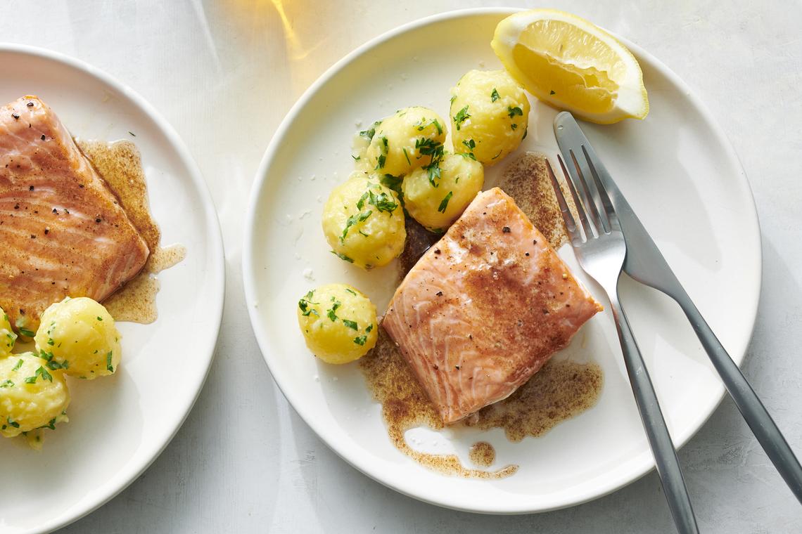 Black pepper salmon with parsley potatoes. Black pepper coats these fillets, enhancing their flavor. Food styled by Simon Andrews. (David Malosh/The New York Times)
