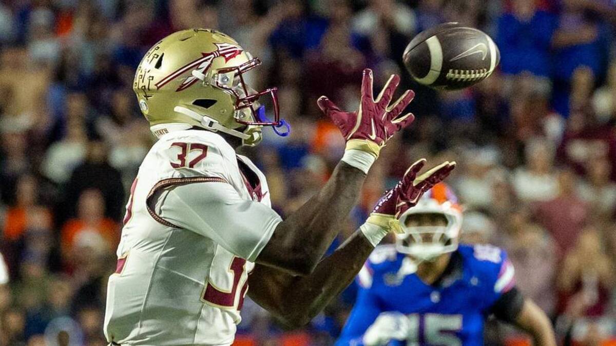  Nov 29, 2025; Gainesville, Florida, USA; Florida State Seminoles running back Ousmane Kromah (32) drops the ball during the second quarter against the Florida Gators at Ben Hill Griffin Stadium. Mandatory Credit: Bob Kupbens-Imagn Images | Bob Kupbens-Imagn Images 