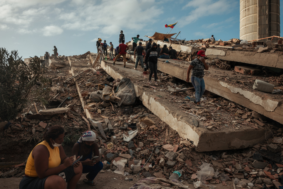 FILE -- Searching for survivors at a public housing complex in Caraballeda, Venezuela, June 29, 2026 after earthquakes. Since two earthquakes struck Venezuela in June, Secretary of State Marco Rubio has sought to bolster the country's interim government. (Adriana Loureiro Fernandez for The New York Times)