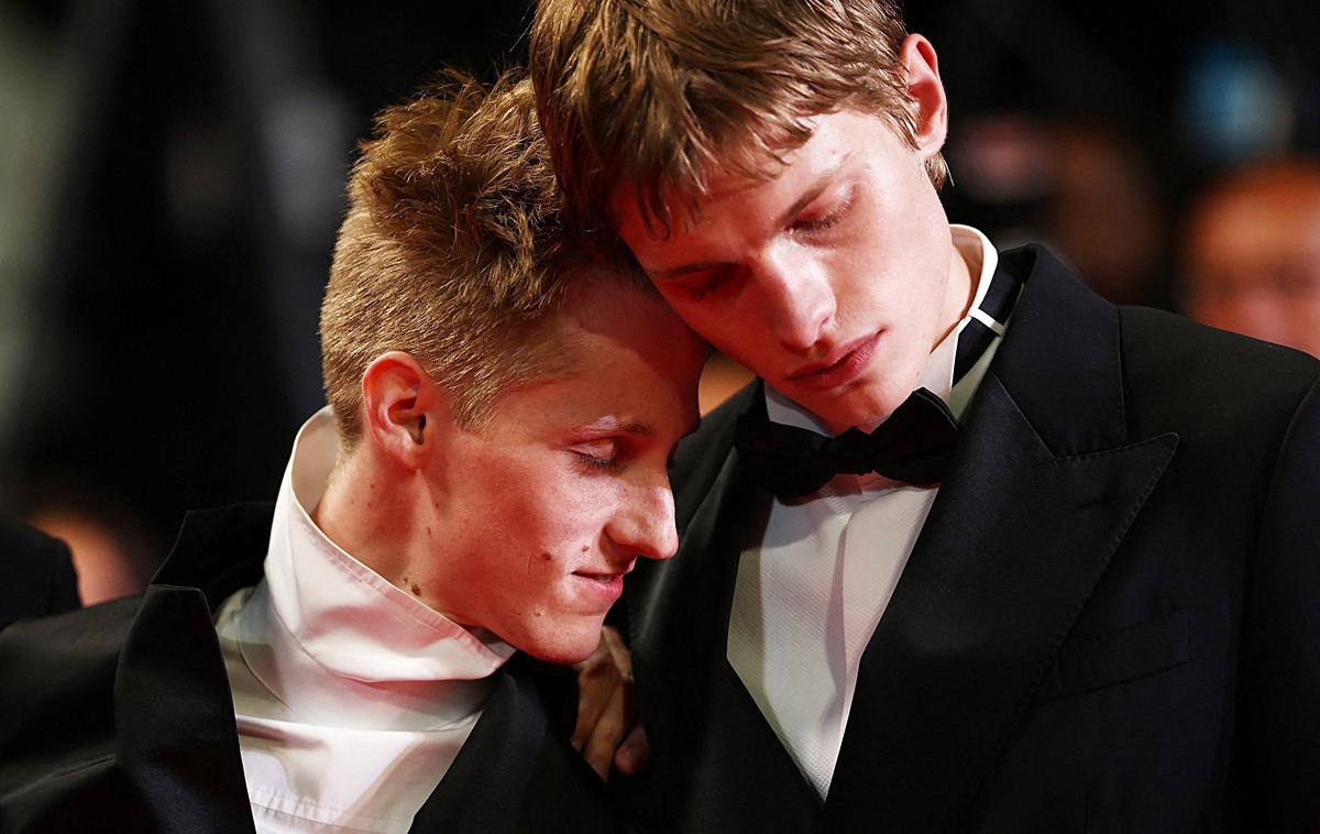 Cast members Emmanuel Machia and Valentin Campagne pose on the red carpet during arrivals for the screening of the film "Coward" in competition at the 79th Cannes Film Festival in Cannes, France, May 21, 2026. REUTERS/Gonzalo Fuentes