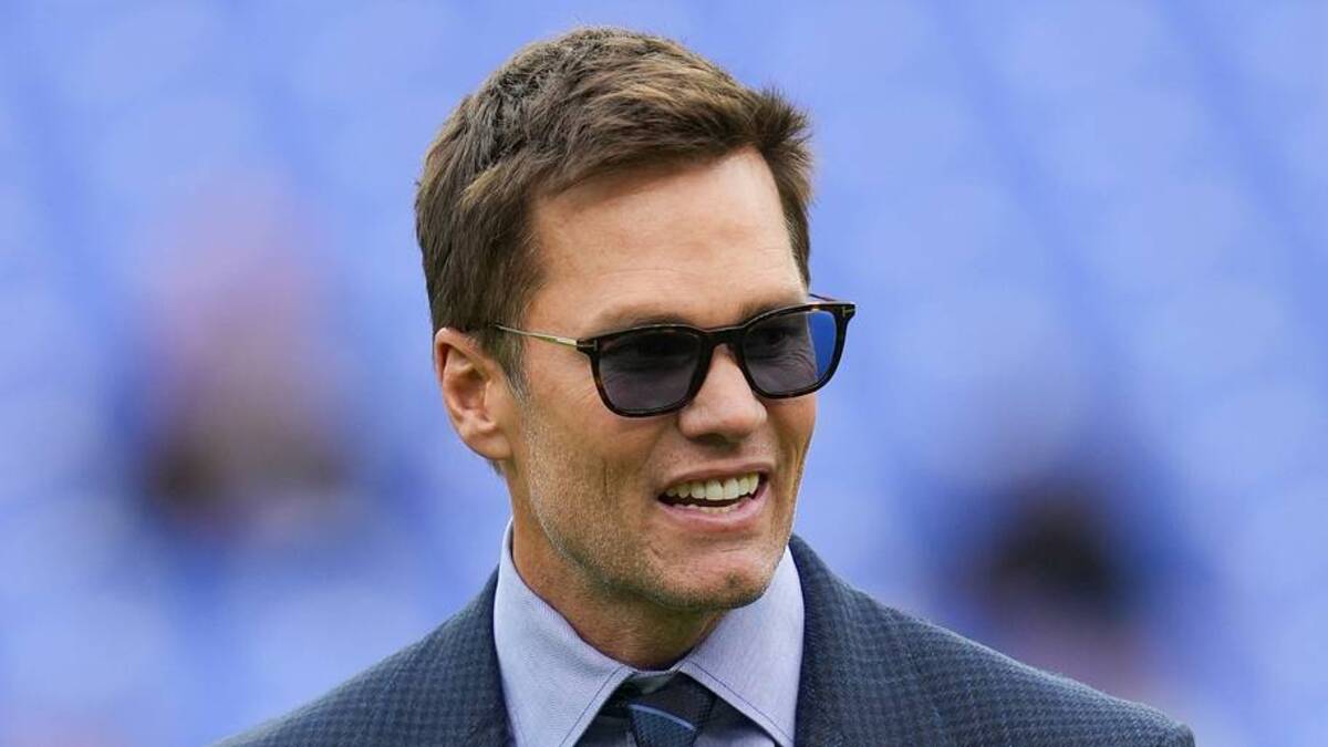  Oct 12, 2025; Baltimore, Maryland, USA; Fox Sports announcer Tom Brady looks on before the game between the Baltimore Ravens and the Los Angeles Rams at M&T Bank Stadium. Mandatory Credit: Mitch Stringer-Imagn Images | IMAGN IMAGES via Reuters Connect 