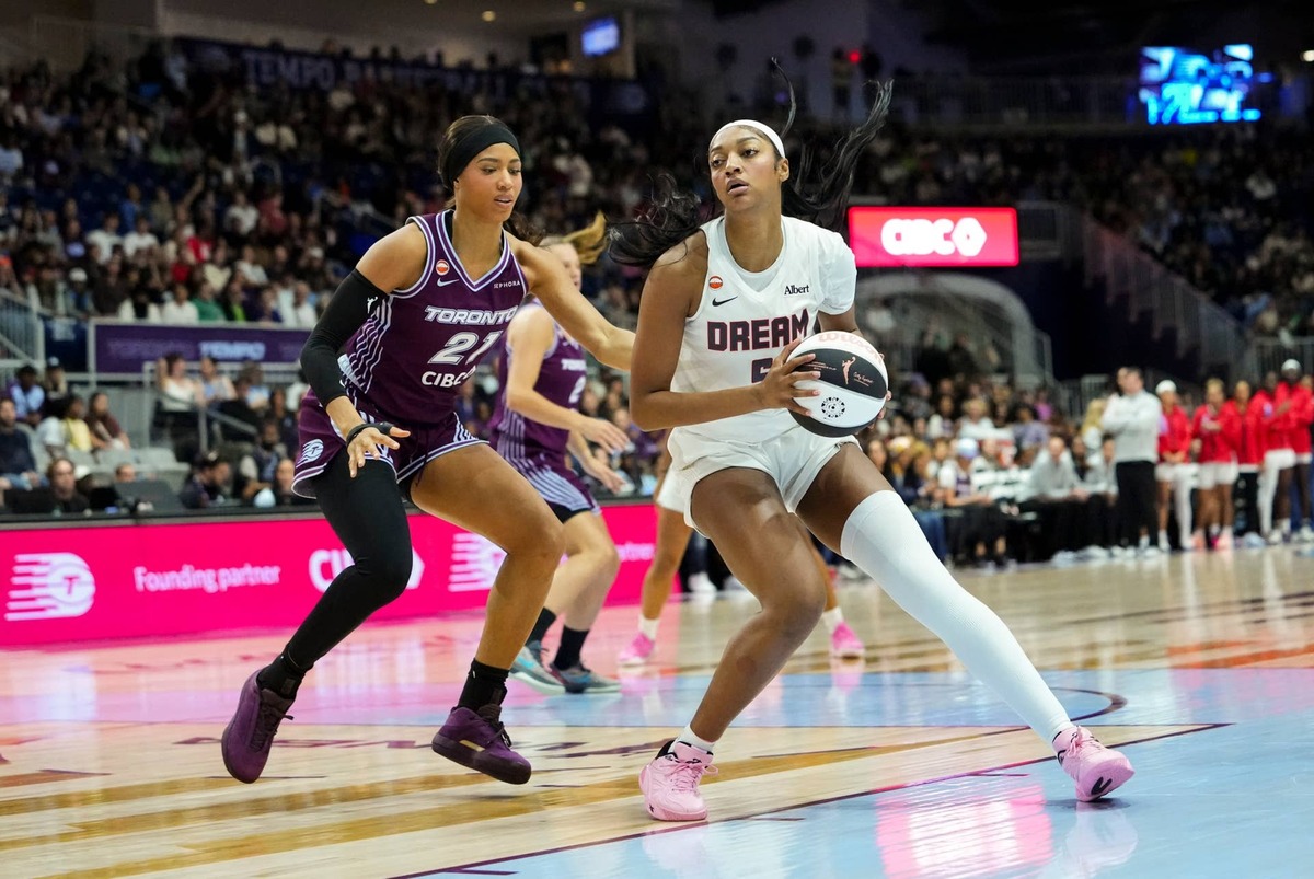  Jun 14, 2026; Toronto, Ontario, CAN; Atlanta Dream forward Angel Reese (5) dribbles against Toronto Tempo forward Isabelle Harrison (21) during the first half at Coca-Cola Coliseum. Mandatory Credit: Kevin Sousa-Imagn Images 