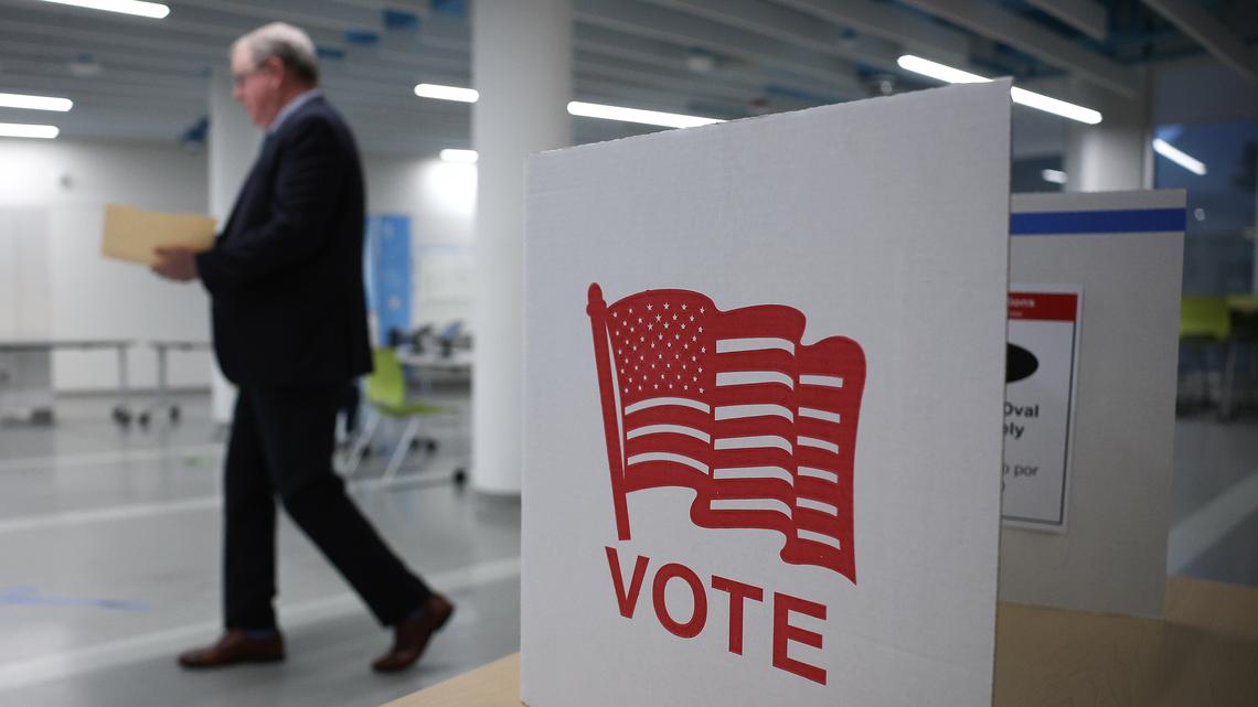 Voters cast their ballots at a polling location at Washington-Liberty High School on April 21, 2026, in Arlington, Virginia. (Win McNamee/Getty Images/TNS)