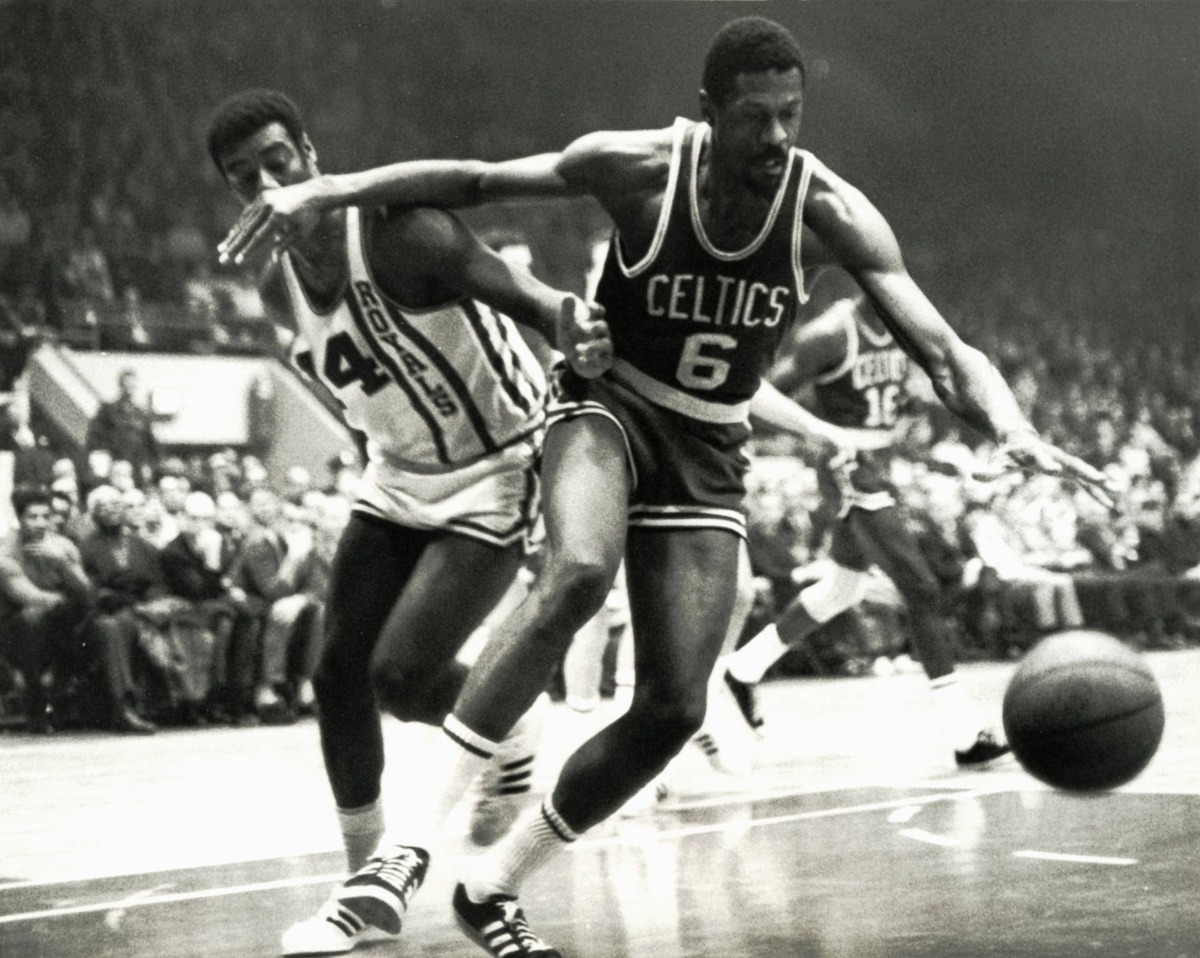  Boston Celtics center Bill Russell fights for a loose ball against Cincinnati Royals guard Oscar Robertson at Cincinnati Gardens. Malcolm Emmons-USA TODAY Sports