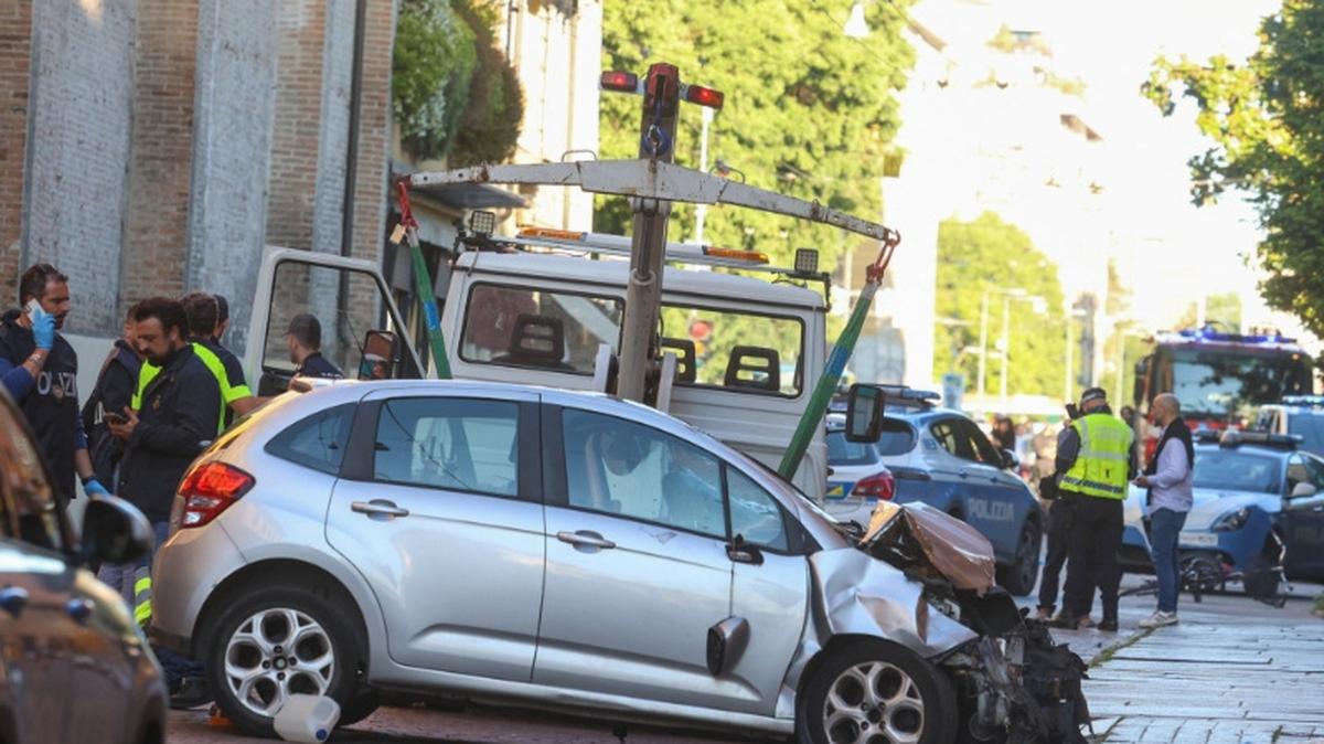 The car that drove into pedestrians is removed from the scene after several people were injured in the center of the northern Italian city of Modena, Italy, May 16, 2026. REUTERS/Stringer