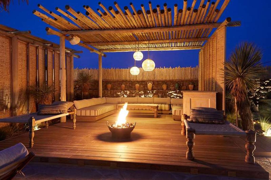  Firepit in the center of an outdoor wood cabana with couches and cots at Jacumba Hot Springs. Photo credit: Jacumba Hot Springs 
