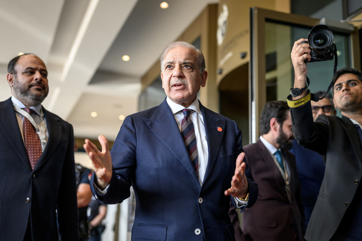 Pakistan's Prime Minister Muhammad Shehbaz Sharif gesture upon arriving at the Buergenstock luxury hotel complex overlooking Lake Lucerne, Switzerland, on June 21, 2026, ahead of high-level talks aimed at advancing a deal to end the Middle East conflict.   Fabrice Coffrini/Pool via REUTERS