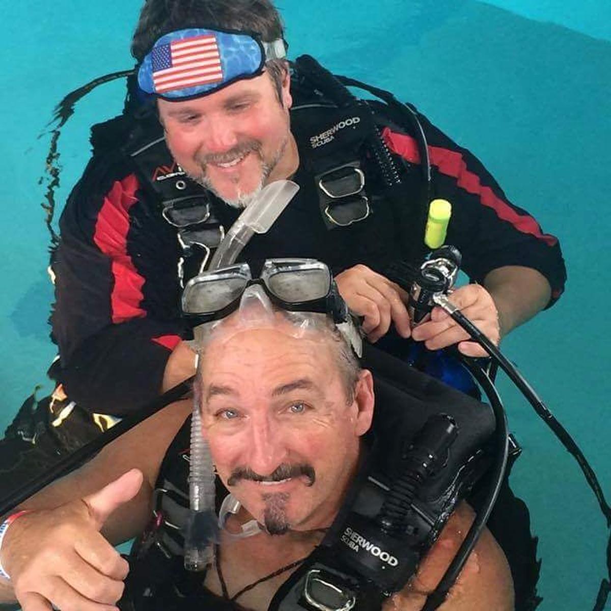 Charley (above) helping quadriplegic Steve MillerLifeWaters