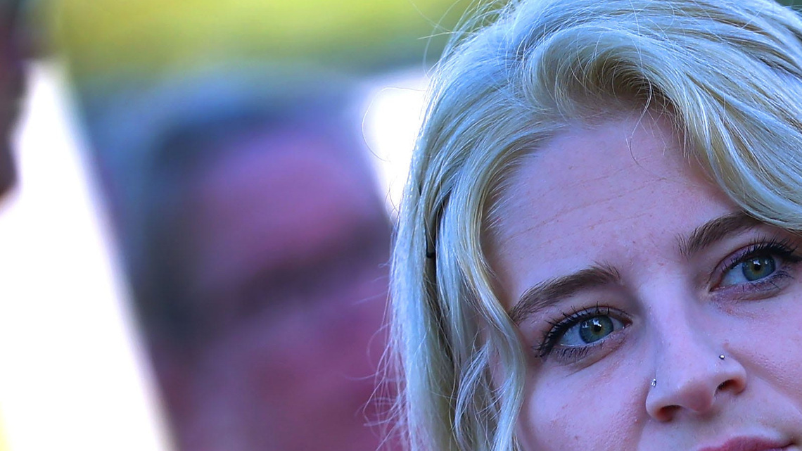 See women in pink gather outside courthouse to support Lindsay Clancy 