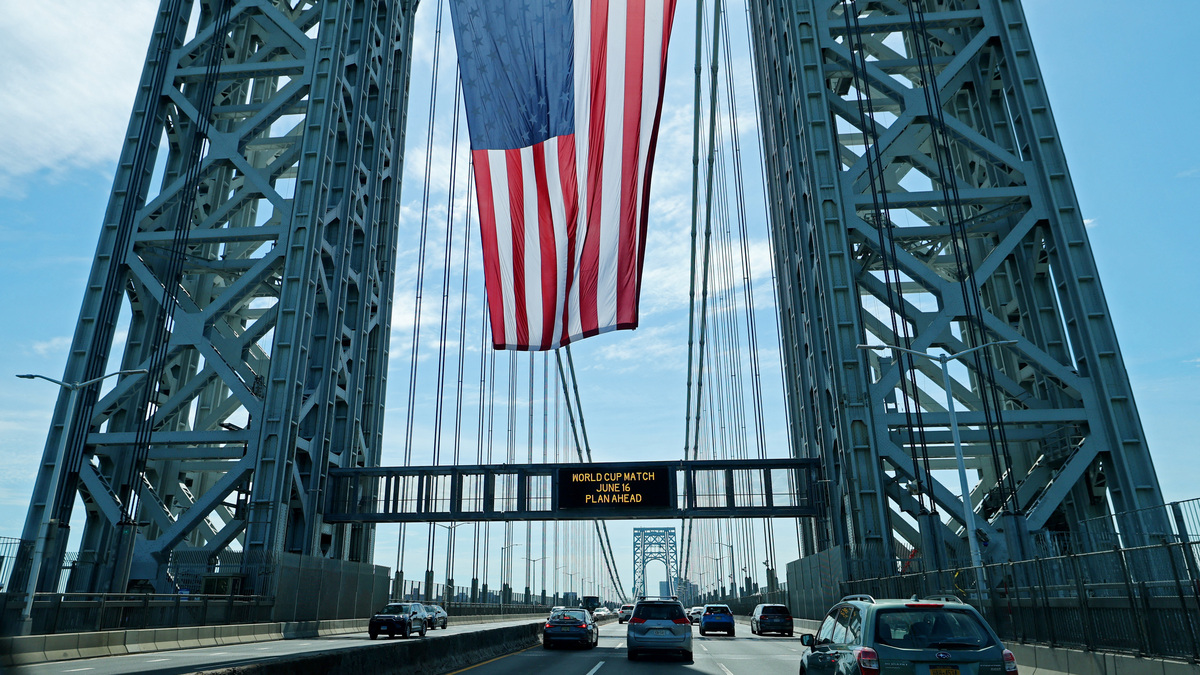 Soccer Football - FIFA World Cup 2026 - Group E - Ivory Coast v Ecuador - New Jersey, U.S. - June 14, 2026 A United States national flag hangs on the George Washington bridge between New Jersey and New York ahead of the match REUTERS/Mike Segar