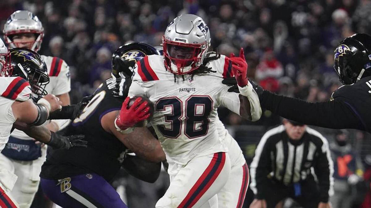  Dec 21, 2025; Baltimore, Maryland, USA; New England Patriots running back Rhamondre Stevenson (38) runs for a touchdown against Baltimore Ravens defensive tackle John Jenkins (94) during the second half of the game at M&T Bank Stadium. Mandatory Credit: James Lang-Imagn Images | James Lang-Imagn Images 