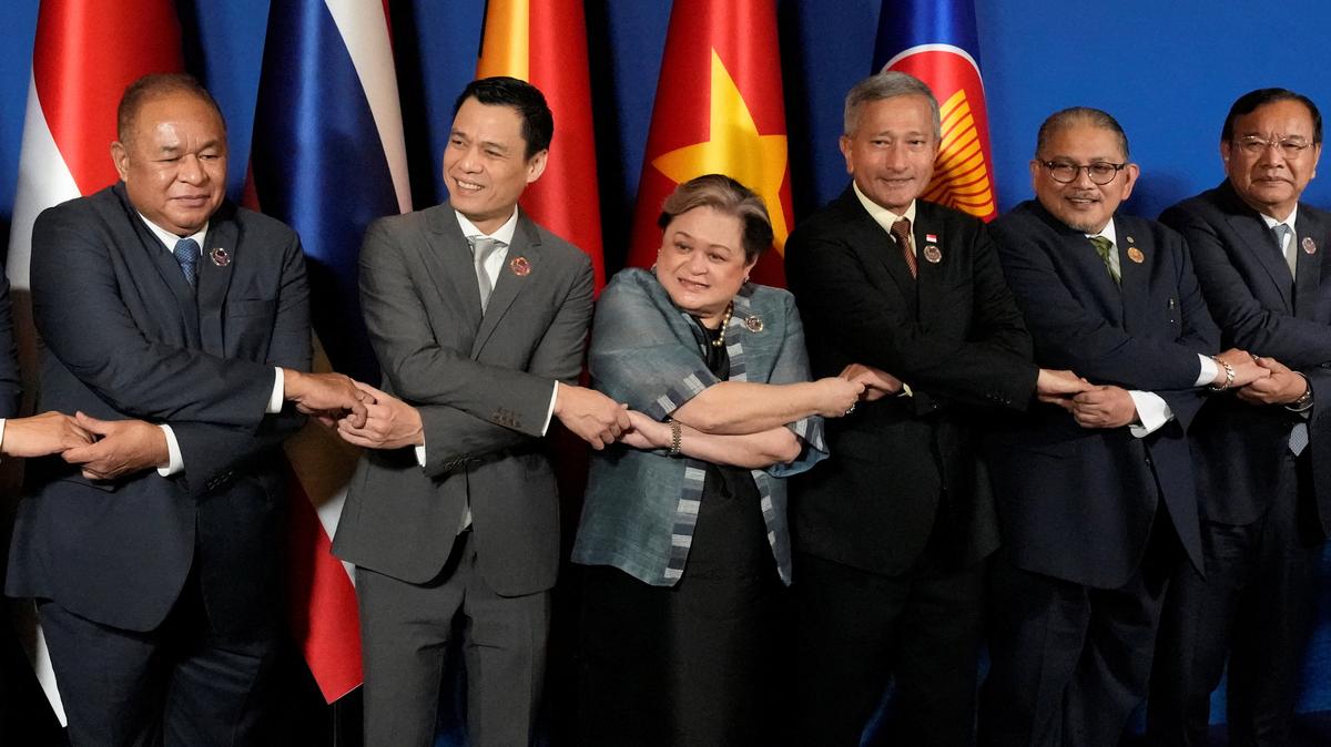 East Timor's Foreign Minister Bendito dos Santos Freitas, Vietnam's Deputy Minister of Foreign Affairs Dang Hoang Giang, Philippine’s Foreign Secretary Theresa Lazaro, Singapore's Foreign Minister Vivian Balakrishnan, Brunei's Second Foreign Minister Erywan Pehin Yusof, and Cambodia's Foreign Minister Prak Sokhonn hold hands during a group photo session at the ASEAN Foreign Ministers’ Meeting ahead of the 48th ASEAN Summit and Related Meetings in Cebu City, Philippines, May 7, 2026. Aaron Favila/Pool via REUTERS
