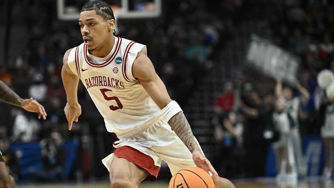  Mar 19, 2026; Portland, OR, USA; Arkansas Razorbacks guard Darius Acuff Jr. (5) drives against the Hawaii Rainbow Warriors in the second half during a first round game of the men's 2026 NCAA Tournament at Moda Center. Mandatory Credit: Craig Strobeck-Imagn Images | Craig Strobeck-Imagn Images 