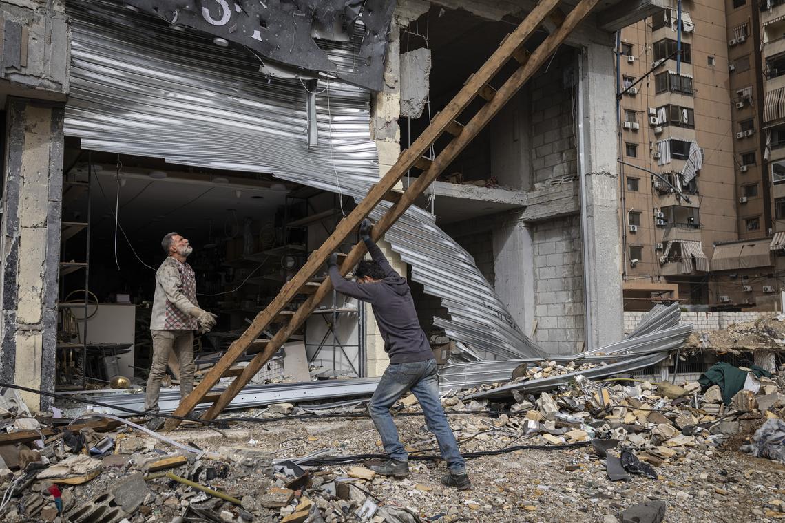 Lebanese men assess damage from Israeli airstrikes in the streets of Dahiyeh, the large southern suburb of Beirut, on the second day of a ceasefire, Saturday, April 18, 2026. People continued to travel back to southern Lebanon in large numbers on Saturday, enabling residents to take stock of the scale of destruction of their homes and villages. (Diego Ibarra Sánchez/The New York Times)