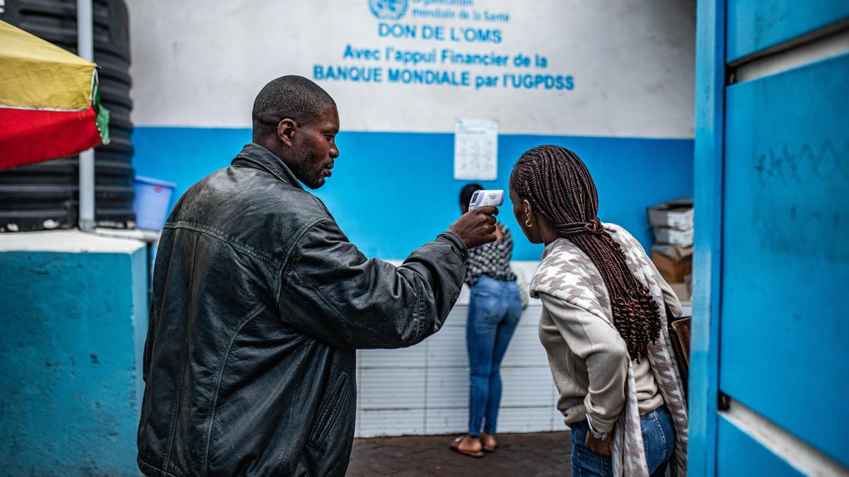 Goma Introduces Health Checks After Ebola Outbreak In NE Congo. A hospital worker takes people's temperatures at Virunga Hospital after health checks were introduced amid the regional Ebola outbreak on May 20, 2026 in Goma, Democratic Republic of Congo. 