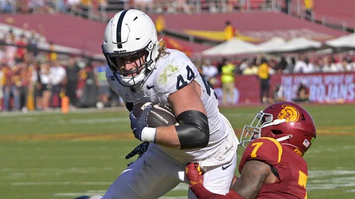  Oct 12, 2024; Los Angeles, California, USA; Penn State Nittany Lions tight end Tyler Warren (44) is stopped by USC Trojans safety Kamari Ramsey (7) after a short gain in the second half at United Airlines Field at the Los Angeles Memorial Coliseum. | Jayne Kamin-Oncea-Imagn Images 