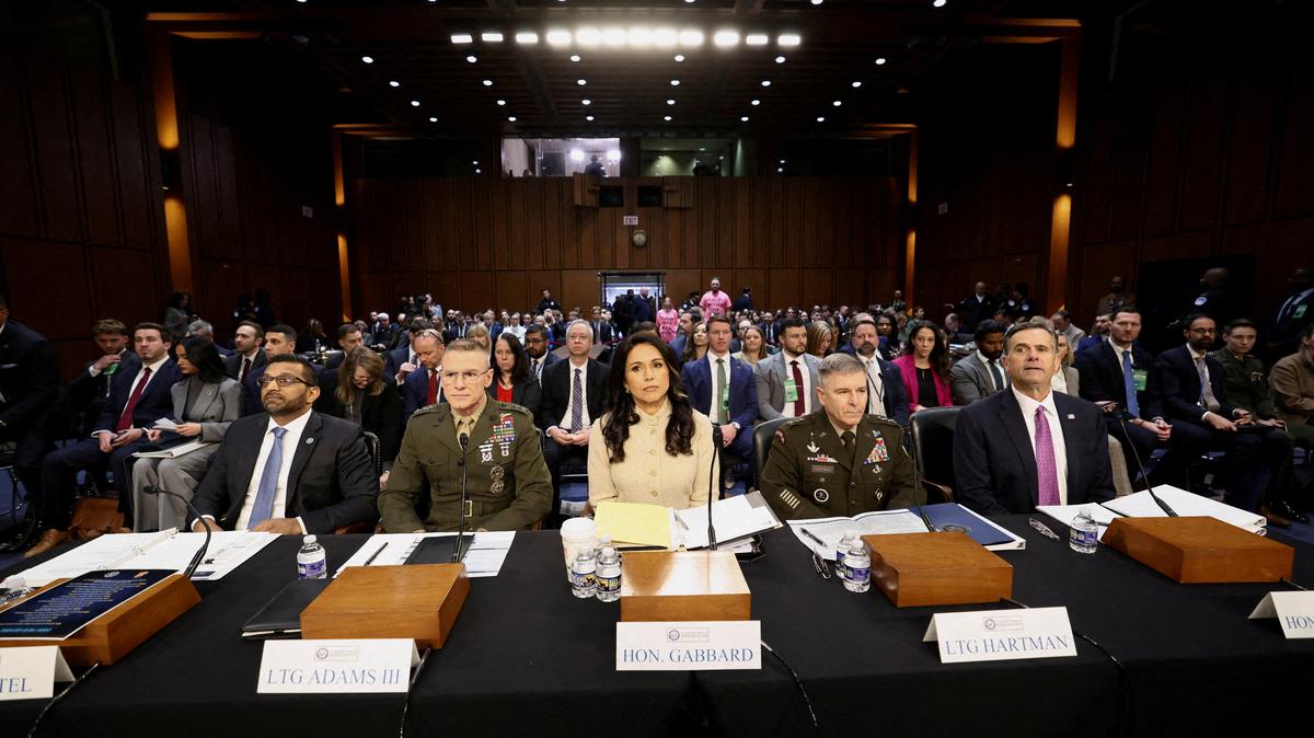 FILE PHOTO: FBI Director Kash Patel, Defense Intelligence Agency Director Lt. Gen. James Adams, Director of National Intelligence (DNI) Tulsi Gabbard, Acting National Security Agency Director Lt. Gen. William Hartman and CIA Director John Ratcliffe testify before a Senate Intelligence Committee hearing on Capitol Hill in Washington, D.C., U.S., March 18, 2026.  REUTERS/Kevin Lamarque/File Photo