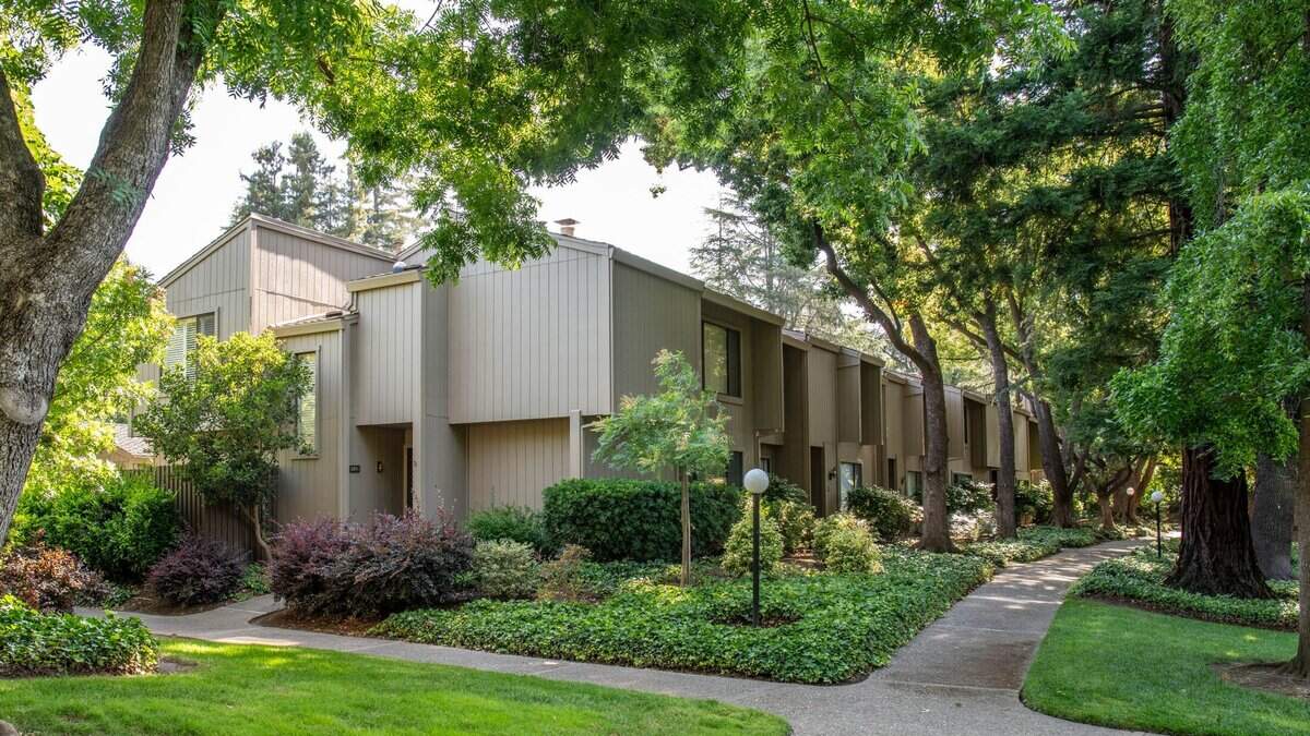 Town homes line a street in Campus Commons, a Sacramento neighborhood with a homeowners'’ association. A new bill would cap how much the groups could raise fees each year. 