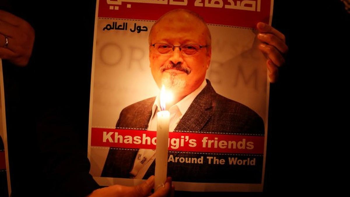 FILE PHOTO: A demonstrator holds a poster with a picture of Saudi journalist Jamal Khashoggi outside the Saudi Arabia consulate in Istanbul, Turkey October 25, 2018. REUTERS/Osman Orsal/File Photo