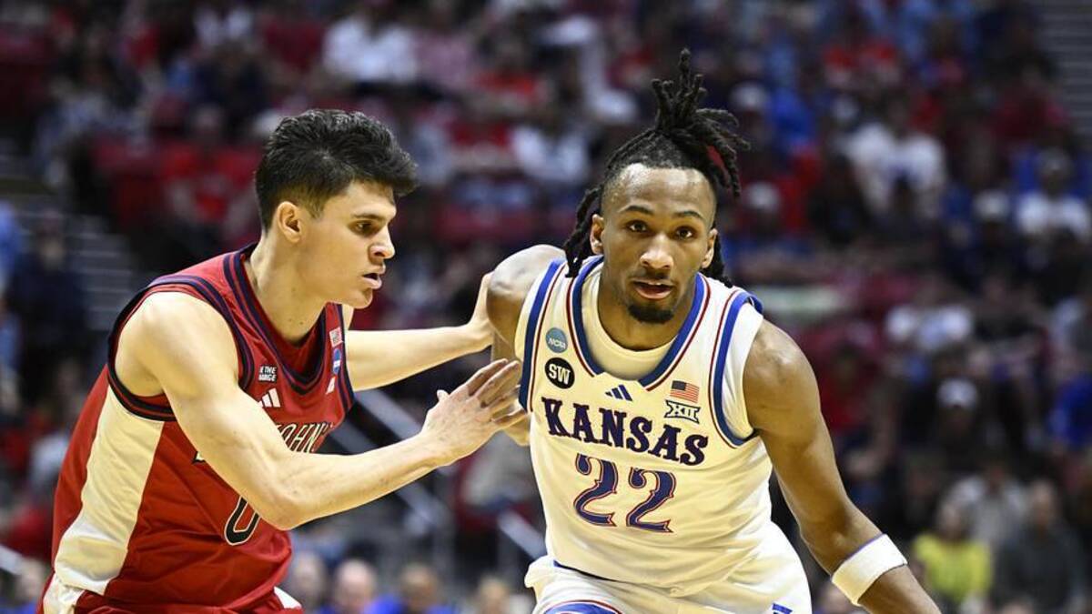  Mar 22, 2026; San Diego, CA, USA; Kansas Jayhawks guard Darryn Peterson (22) controls the ball against St. John's Red Storm guard Dylan Darling (0) in the first half during a second round game of the men's 2026 NCAA Tournament at Viejas Arena. | Denis Poroy-Imagn Images 