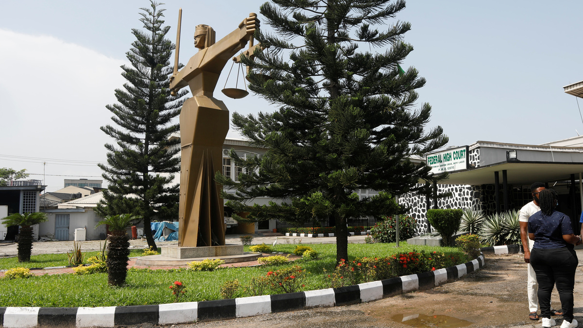 People stand outside the Federal High Court in Lagos, Nigeria October 27, 2020. REUTERS/Temilade Adelaja