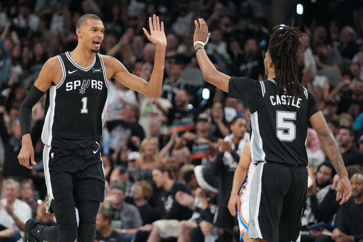  May 28, 2026; San Antonio, Texas, USA; San Antonio Spurs forward Victor Wembanyama (1) reacts with guard Stephon Castle (5) in the second half during game six of the western conference finals for the 2026 NBA playoffs at Frost Bank Center. Mandatory Credit: Daniel Dunn-Imagn Images 