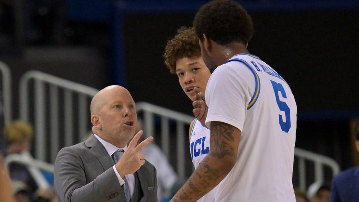  Feb 7, 2026; Los Angeles, California, USA; UCLA Bruins head coach Mick Cronin talks with guard Trent Perry (0) and guard Brandon Williams (5) in the second half against the Washington Huskies at Pauley Pavilion presented by Wescom Financial. Mandatory Credit: Jayne Kamin-Oncea-Imagn Images | Jayne Kamin-Oncea-Imagn Images 