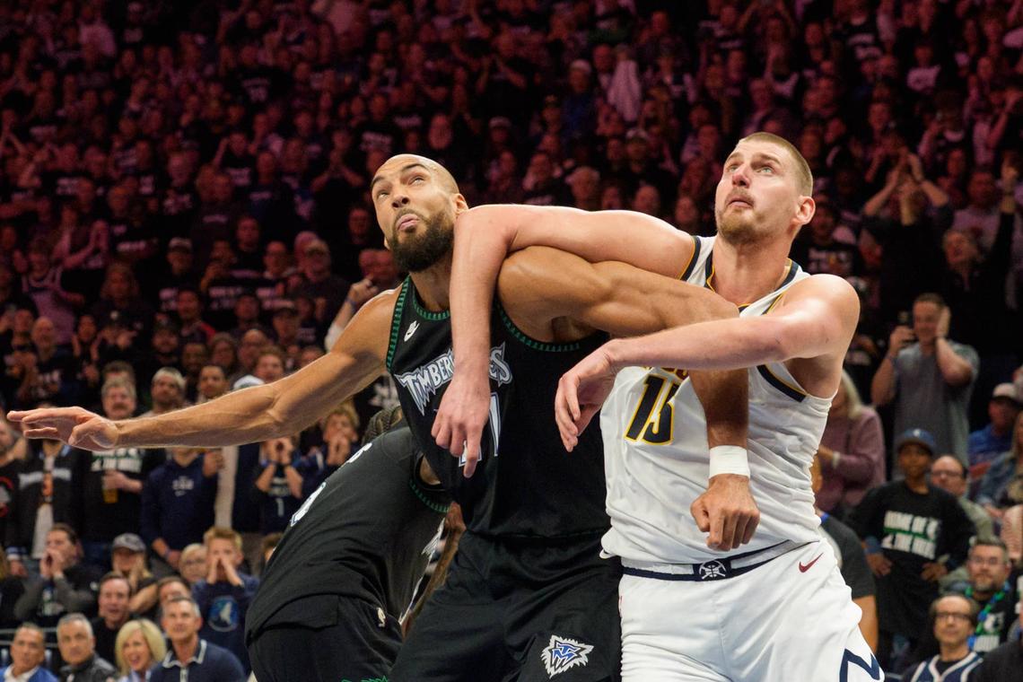  Minnesota Timberwolves center Rudy Gobert (27) and Denver Nuggets center Nikola Jokic (15) position themselves for a rebound. 